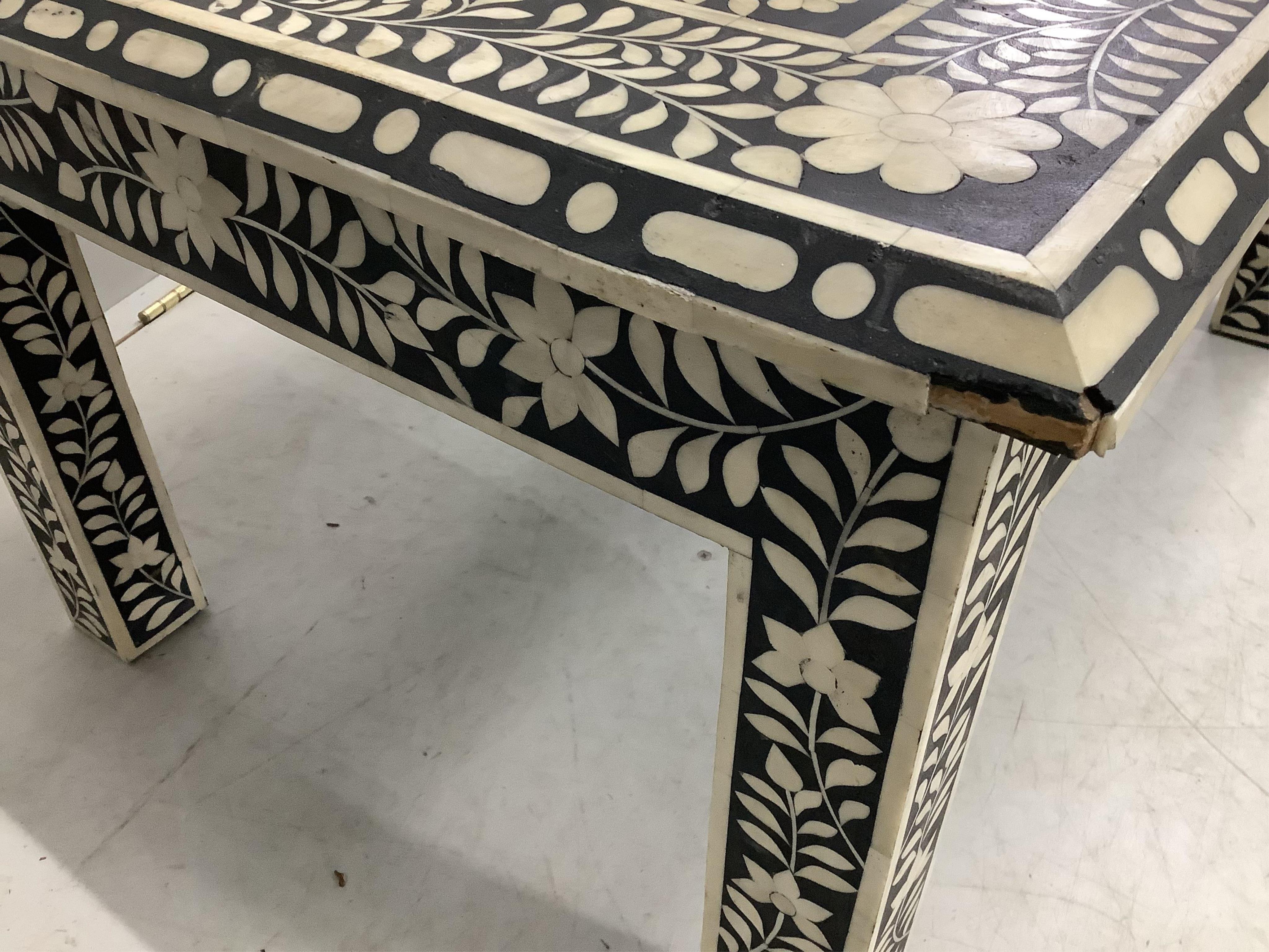 A rectangular faux ivory inlaid low games table, width 92cm, depth 42cm, height 36cm. Condition - fair to good.